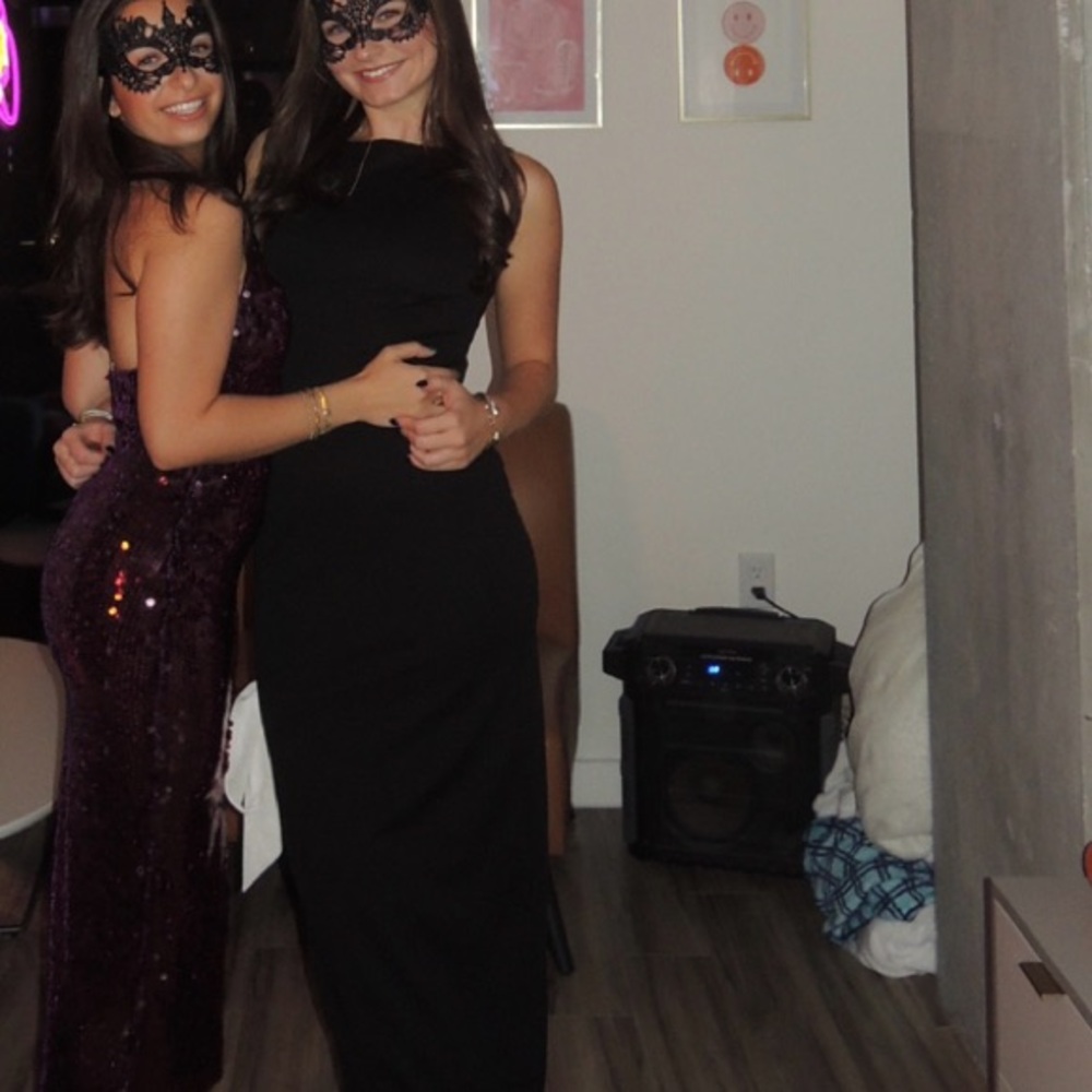 More To Come black dress with white bow